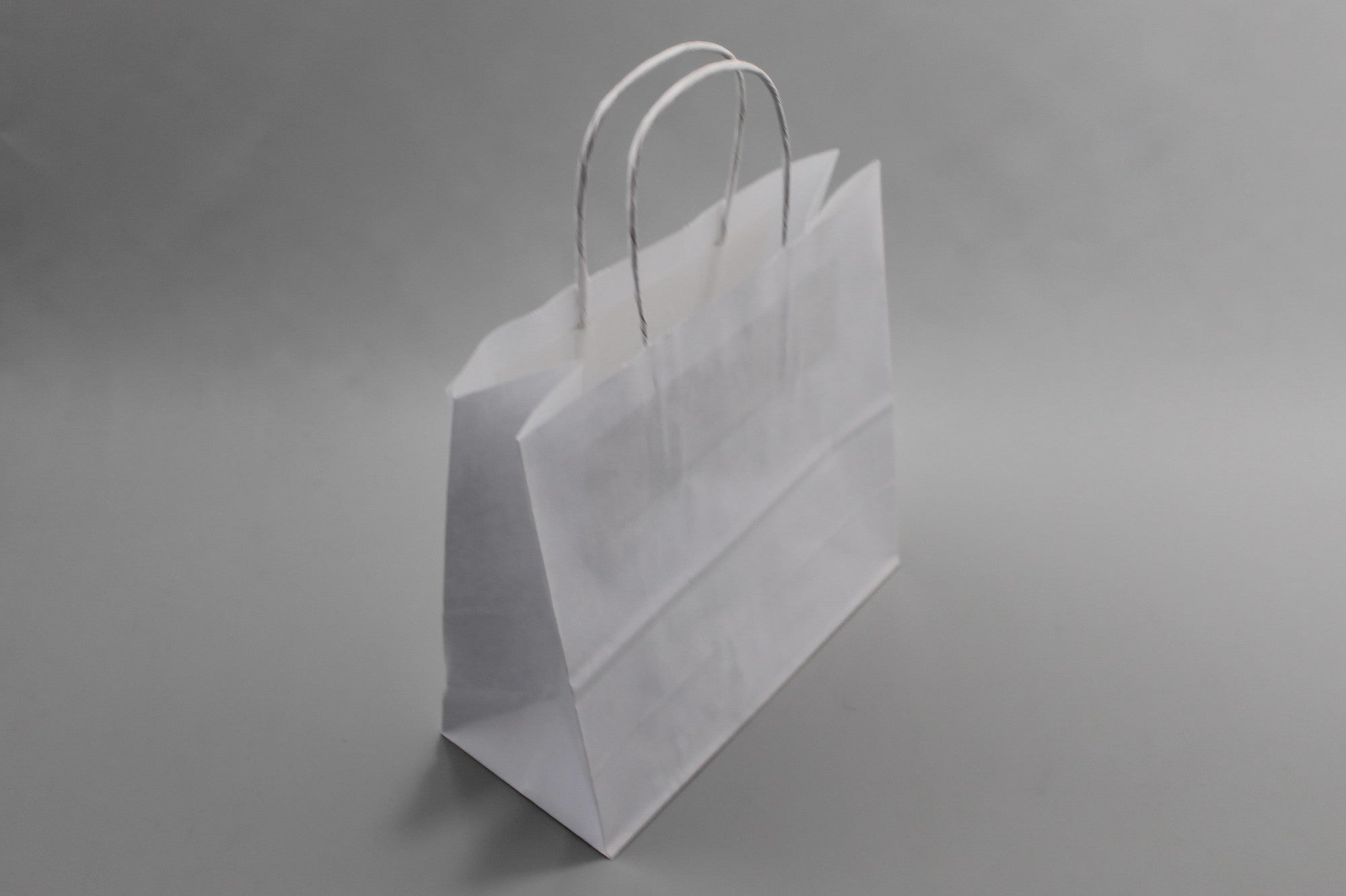 Paper Carrier Bags White 14x8x21cm Kraft 90 g/gm with twisted handles